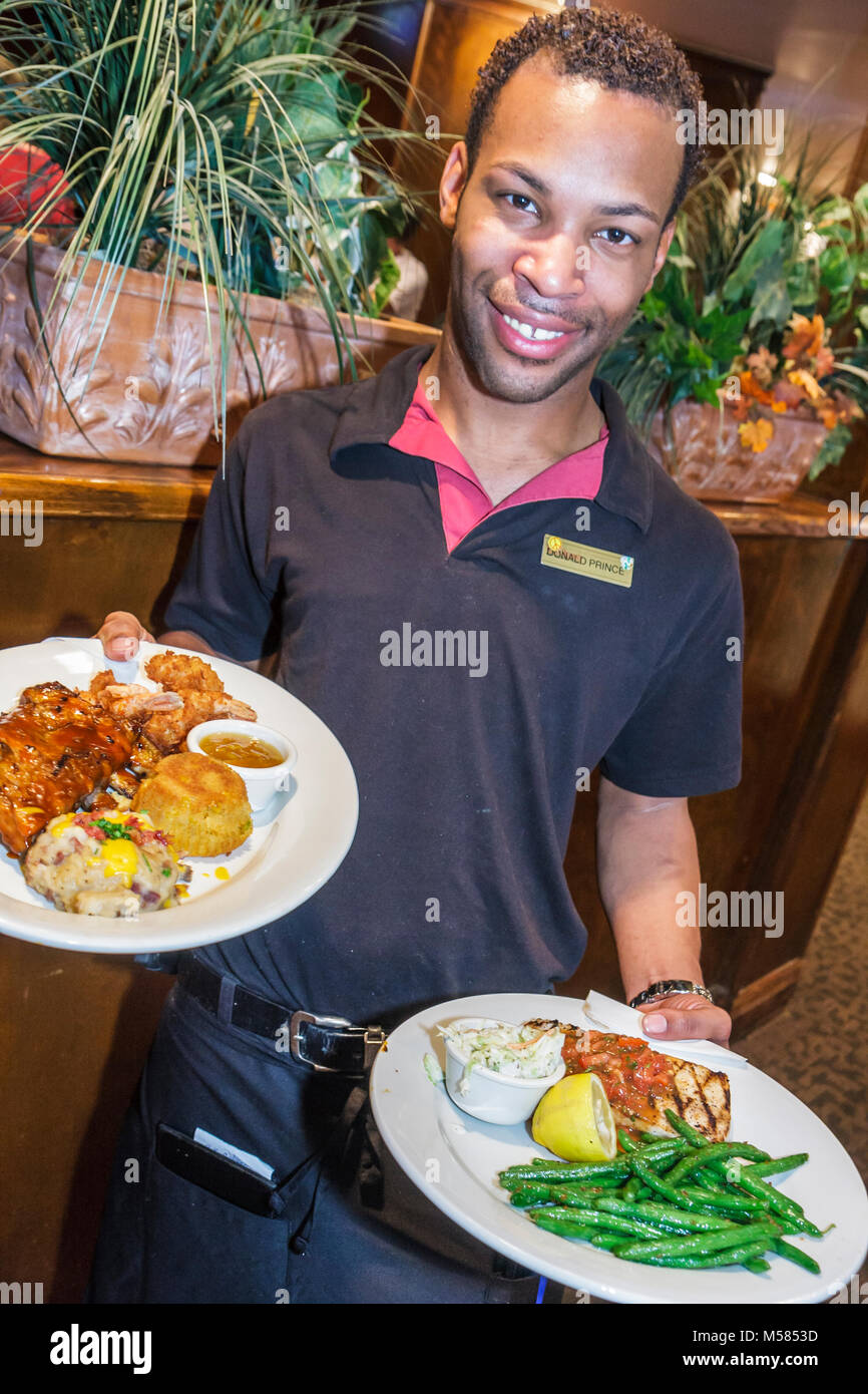Miami Florida,Tony Roma's,restaurant restaurants food dining cafe cafes,Black man men male adult adults,waiter waiters server employee worker workers Stock Photo