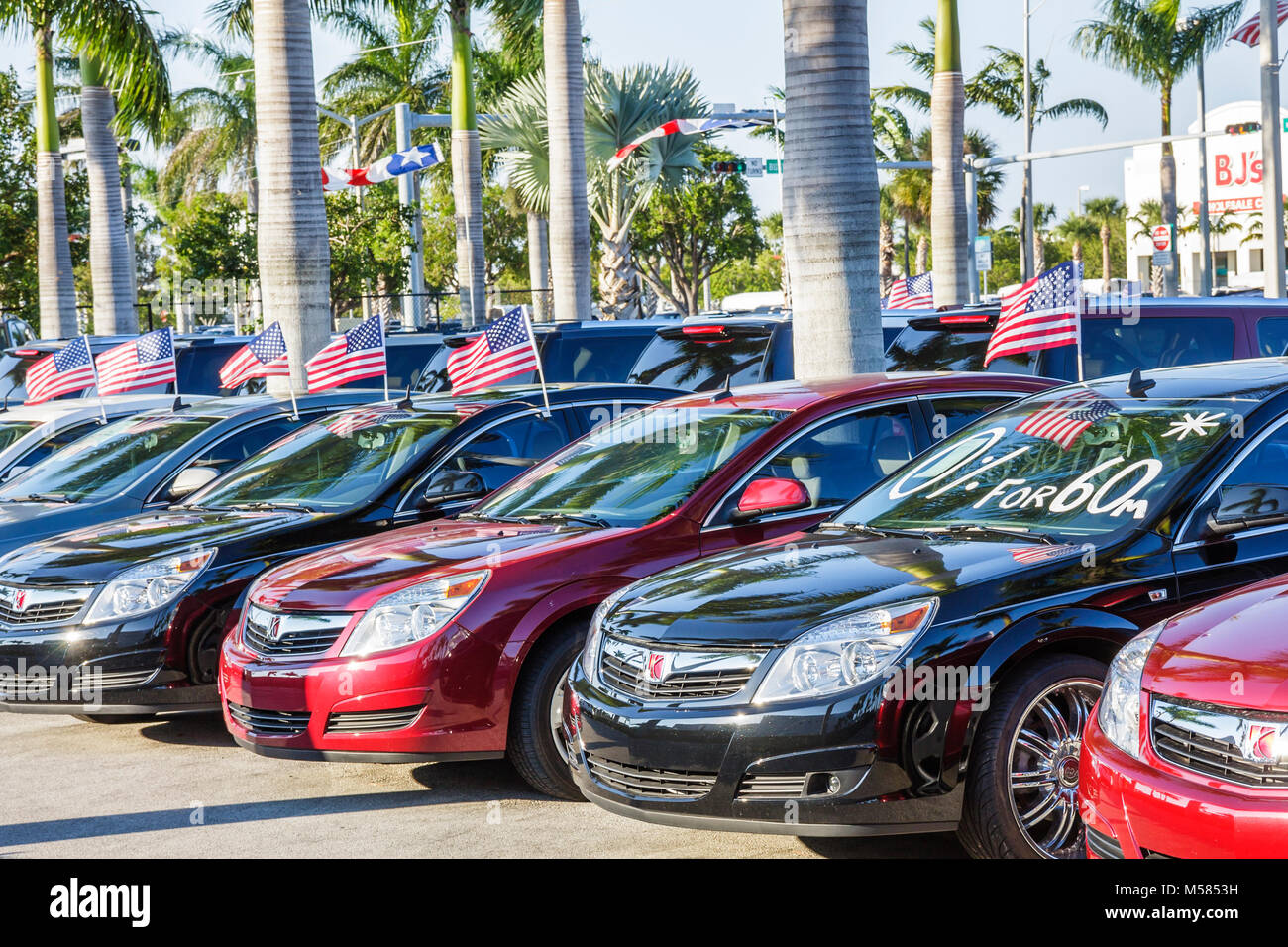 Miami Florida,GM,General Motors,Saturn,Aura,new,car,dealer,dealership lot,automobiles,sale,special,zero percent,FL080202028 Stock Photo