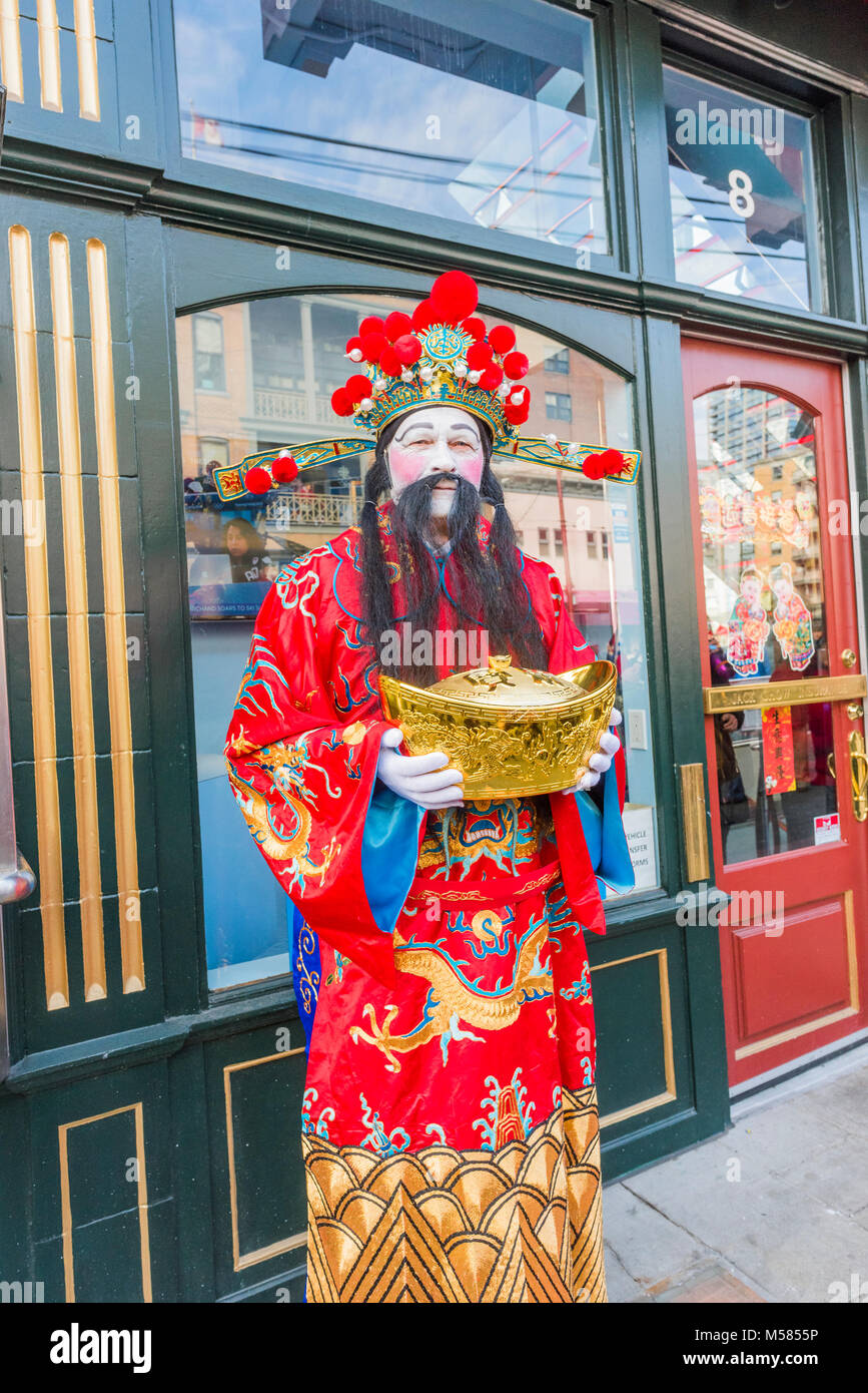 A performer dressed as Caishen, the Chinese god of wealth, prosperity, good fortune, Chinese Lunar New Year Parade, Chinatown, Vancouver, BC Stock Photo