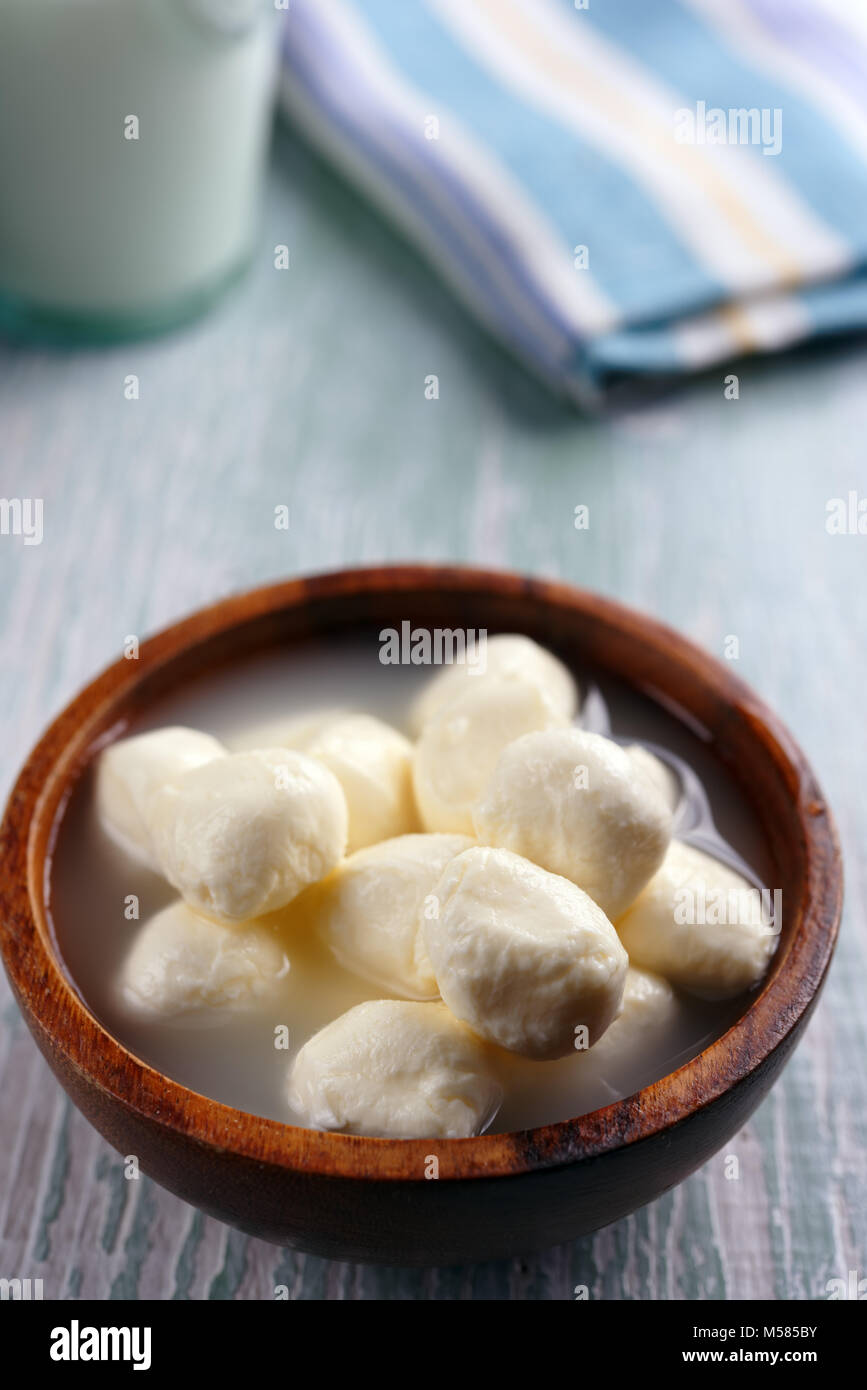 Small mozzarella cheese balls in brine Stock Photo Alamy