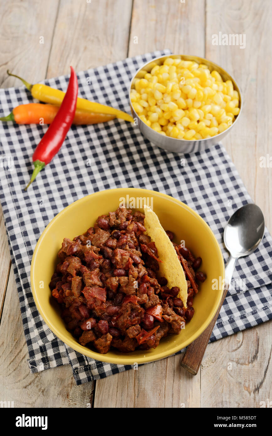 Chili con carne with corn and corn chips Stock Photo