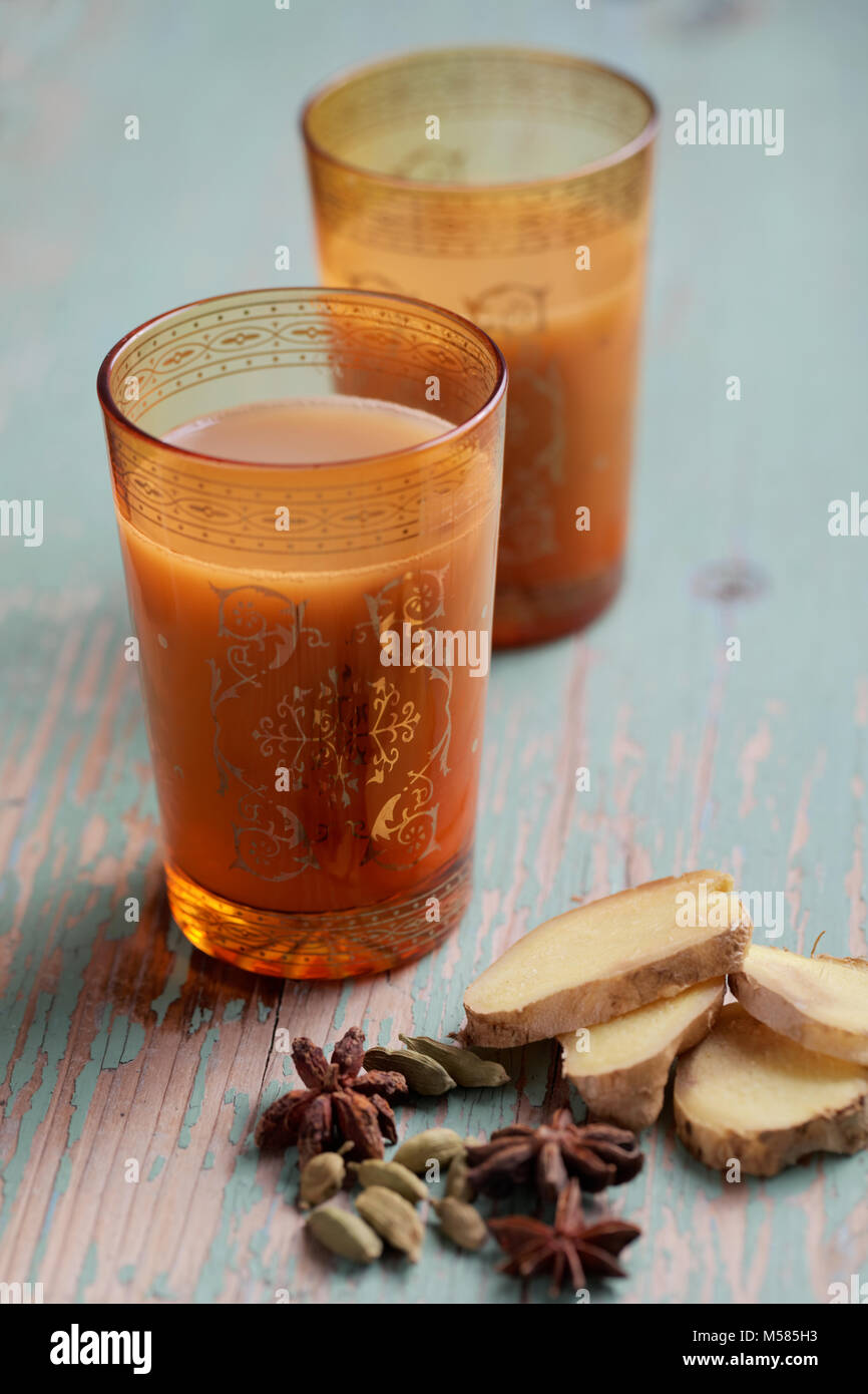 Indian chai in glass cups with metal kettle and other masalas to make the  tea Stock Photo - Alamy