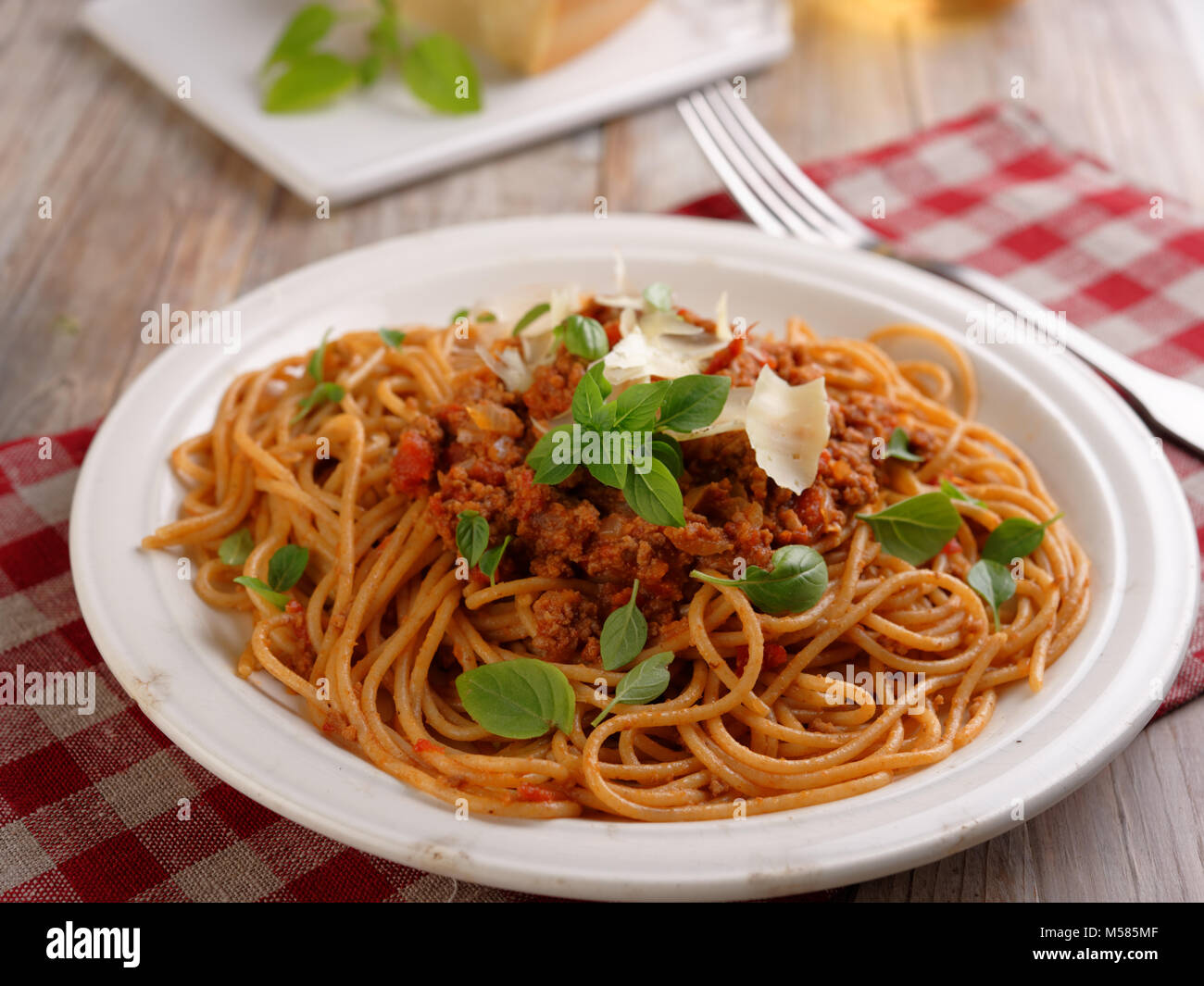 Spaghetti alla bolognese with basil and Parmesan cheese Stock Photo Alamy