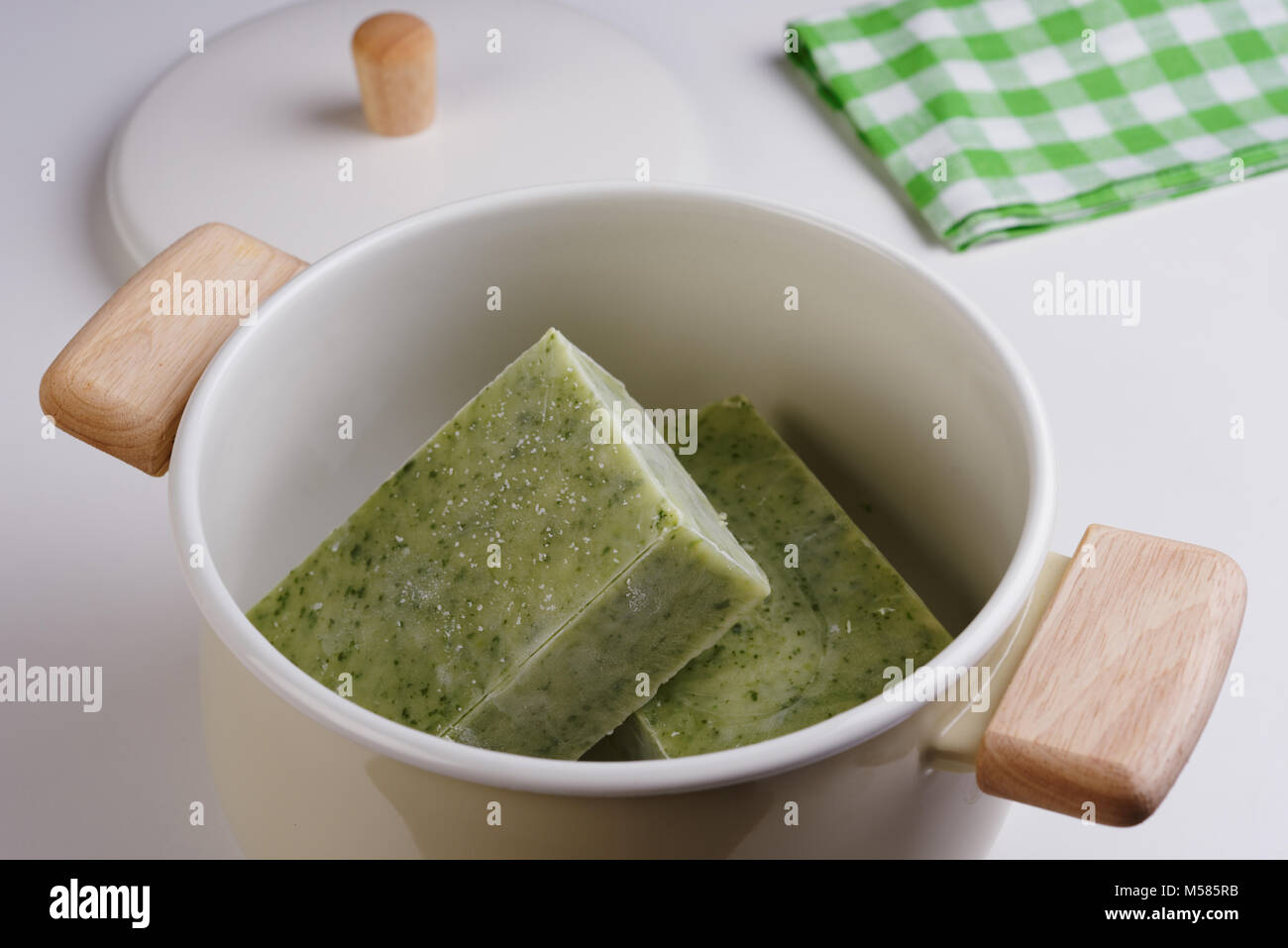 Frozen spinach and cauliflower soup in a cooking pan Stock Photo