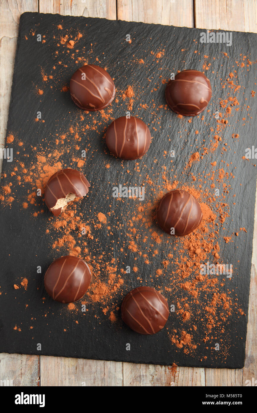 Chocolate foam kisses on a slate board Stock Photo Alamy