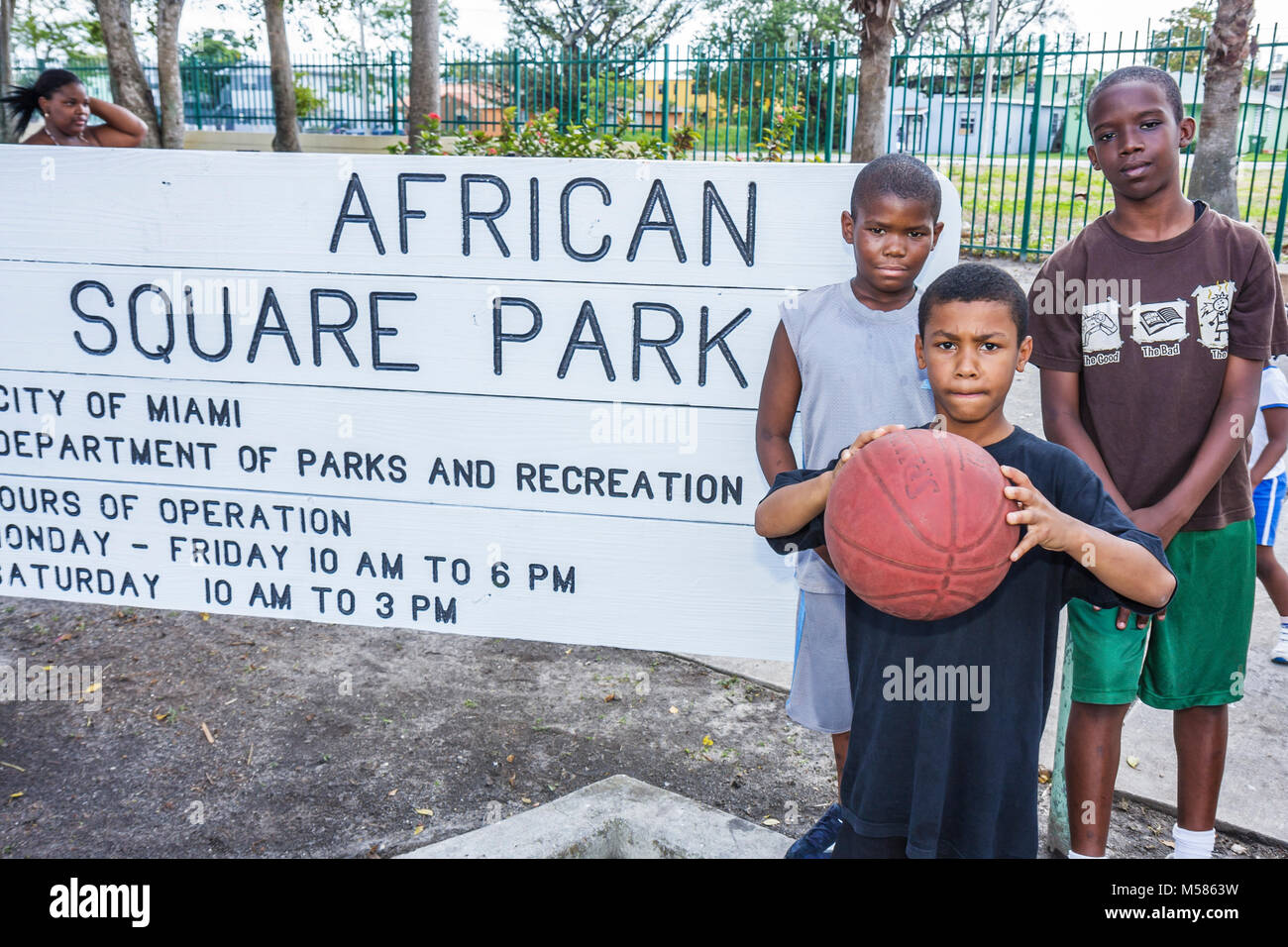 Miami Florida,Liberty City,African Square Park,inner city,low income,poverty,Black boy boys,male kid kids child children youngster,child,child,childre Stock Photo
