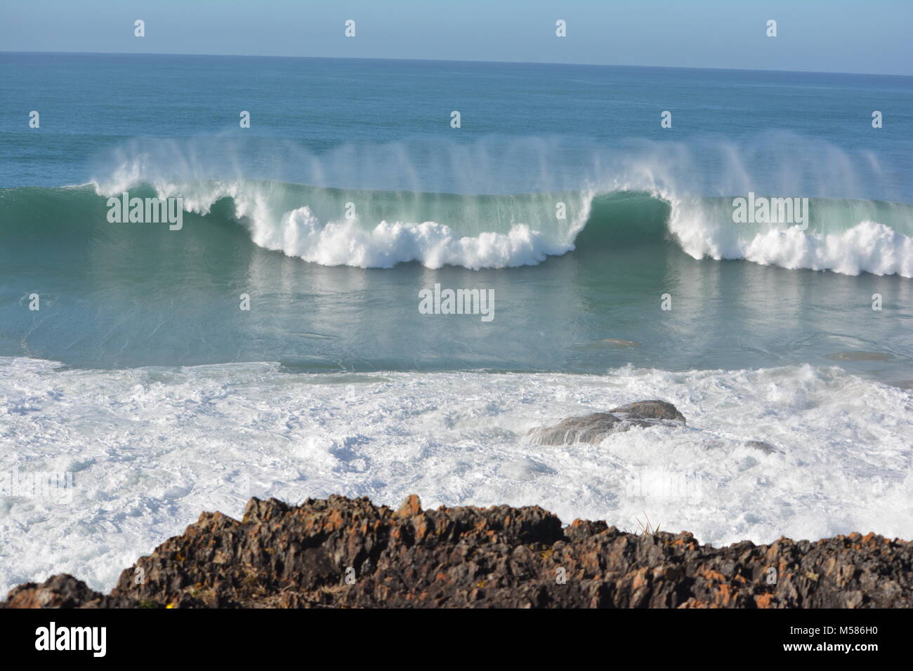 Waves rolling in and being reflected on the Ocean water at Sawtell, NSW