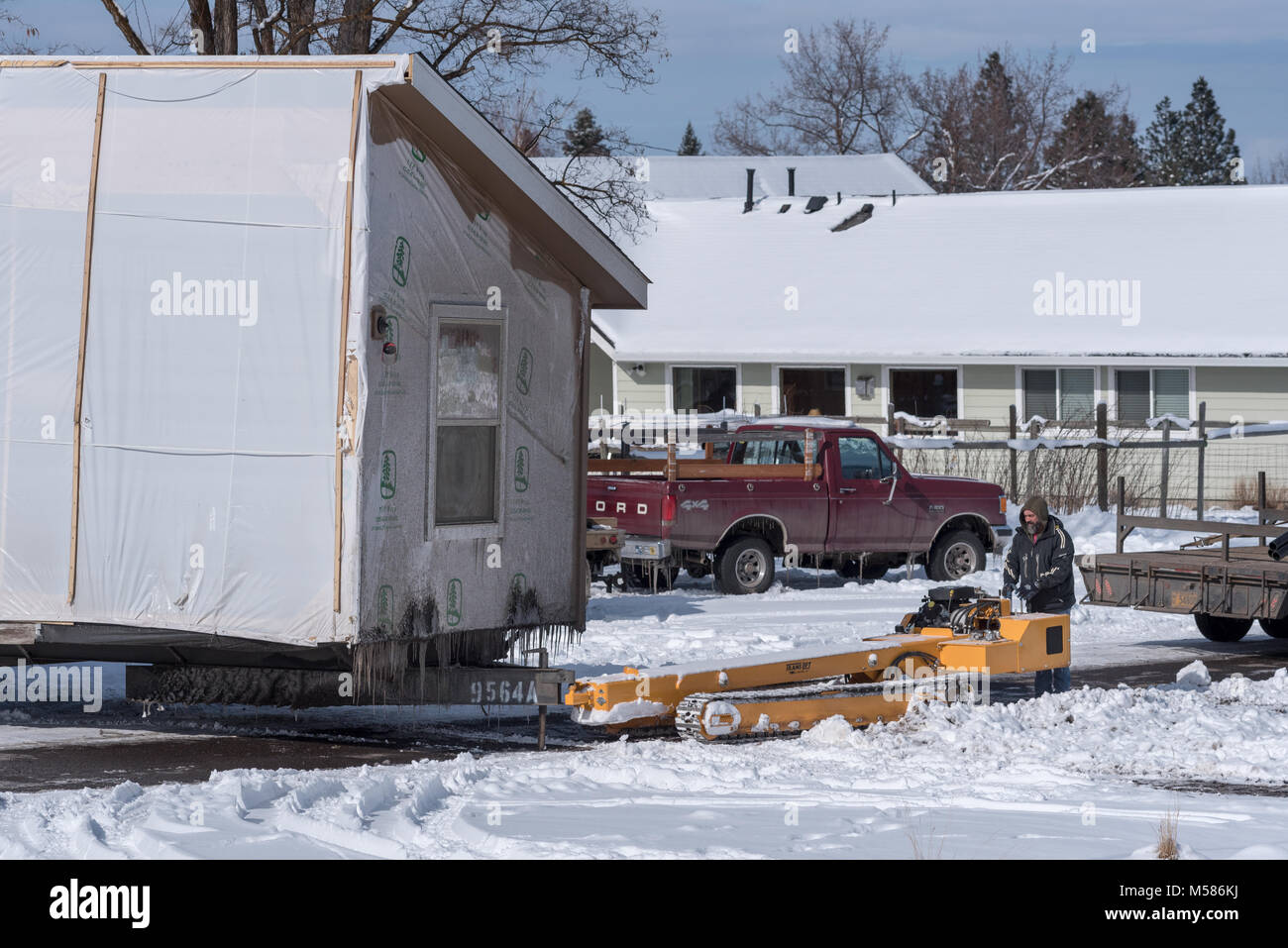 Using a hydraulic house mover to position a modular home in Joseph