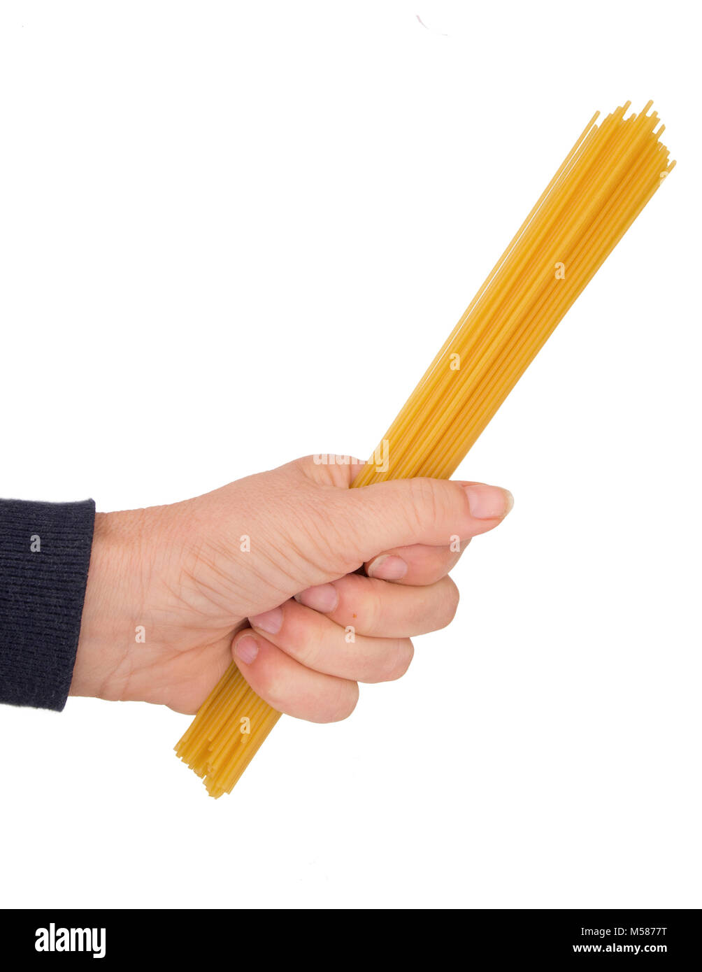 Hand with gluten free spaghetti. Stock Photo