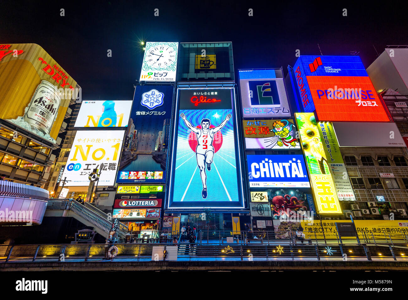 OSAKA, JAPAN - FEB 15, 2018 : Tourist walking in night shopping street at Dotonbori in Osaka, Japan  on February 15,2018 Stock Photo