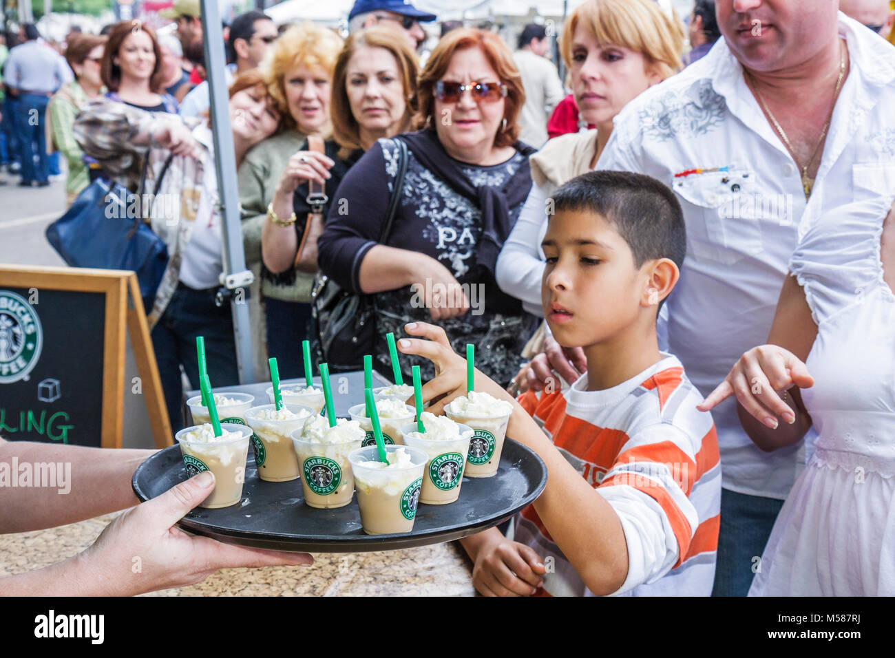 Miami Florida,Coral Gables,Miracle Mile,Coral Way,Carnaval on the Mile,Hispanic Festival,festivals fair,community child,adults,line,consumers,free sam Stock Photo