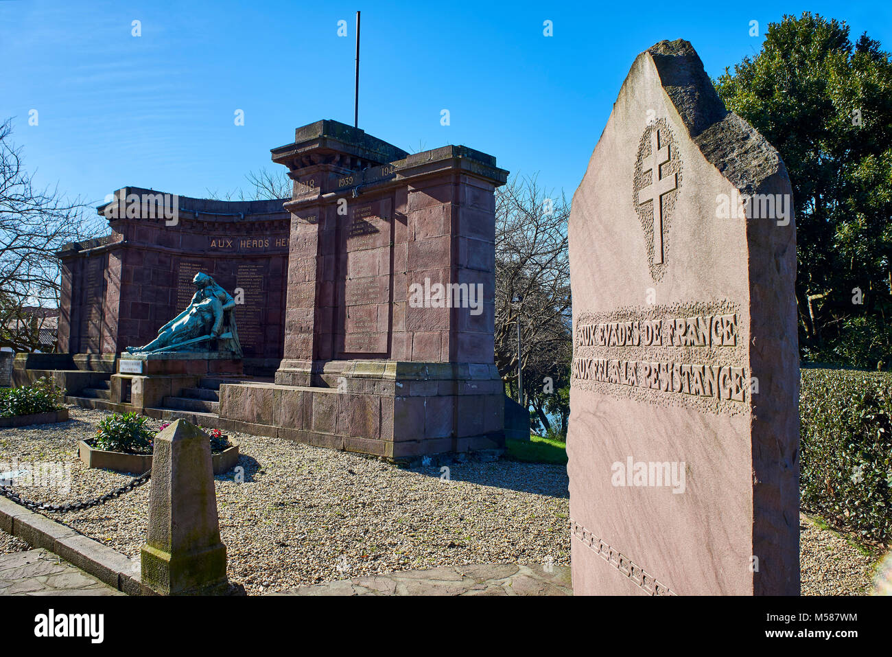Hendaye, France - January 28, 2018. Cross of Lorraine headstone in honor of the escapees of France and to the Resistance with Memorial monument dedica Stock Photo