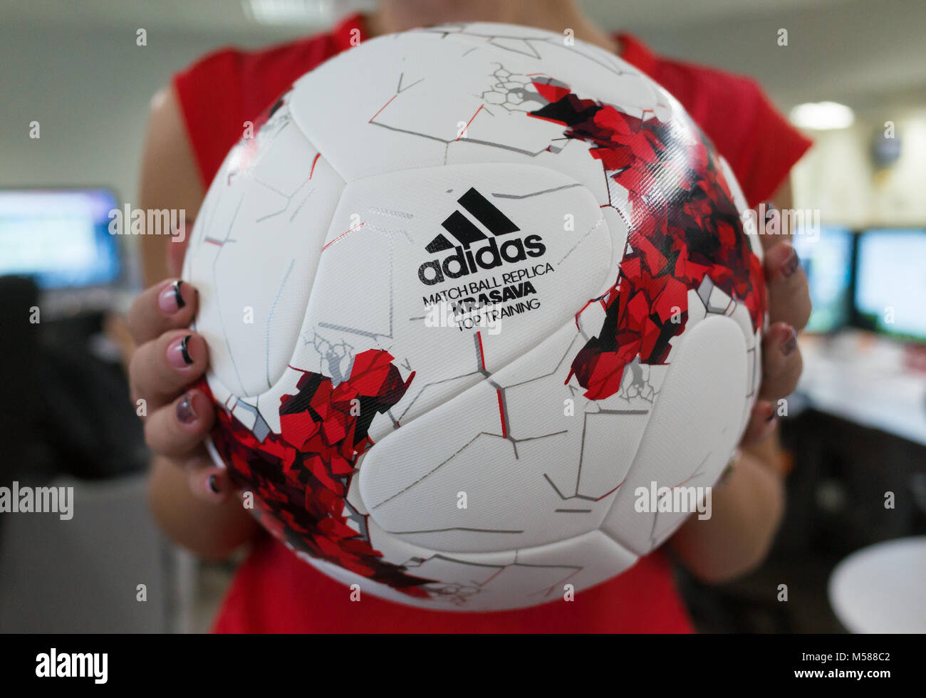 September 14, 2017. Moscow, Russia A young girl holding the Official ball  of the 2018 FIFA World Cup Adidas Krasava Stock Photo - Alamy