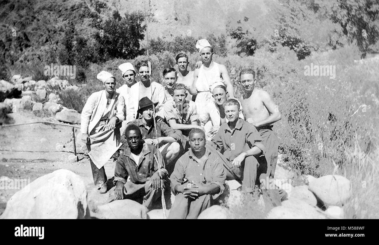 Grand Canyon Historic  CCC Cooks at Camp  Phantom. B/W PHOTO ENTITLED KITCHEN CREW, SHOWING 13 PEOPLE THAT MADE UP THE  KITCHEN CREW OF CIVILIAN CONSERVATION CORPS CAMP #818, PHANTOM RANCH. CHEFS K.P.  CAMP 1935. Stock Photo