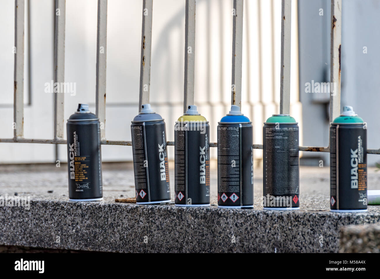 Colorful spray cans are ready for use Stock Photo