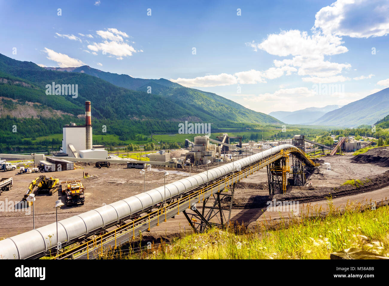 Big industrial infrastructure among mountains in Alberta, Canada Stock Photo