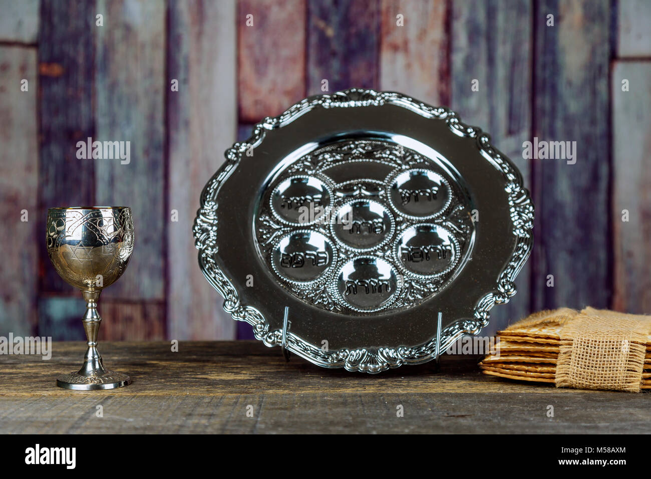 Jewish holidays Passover Pesach matzah and a silver cup full of wine