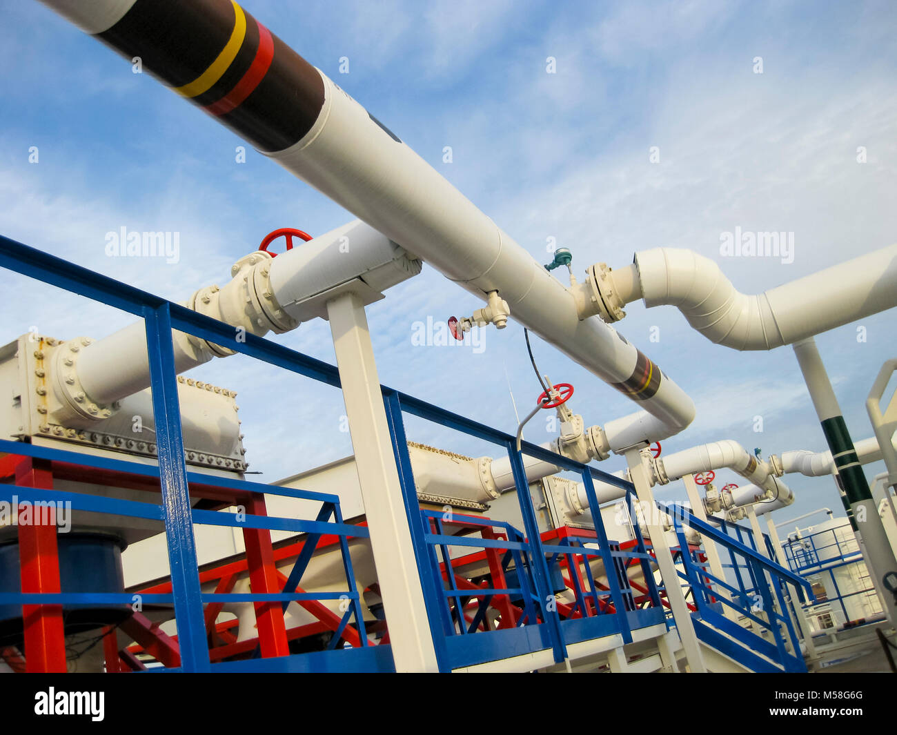 Pipes over Gasoline air coolers. Oil refinery. Equipment for primary