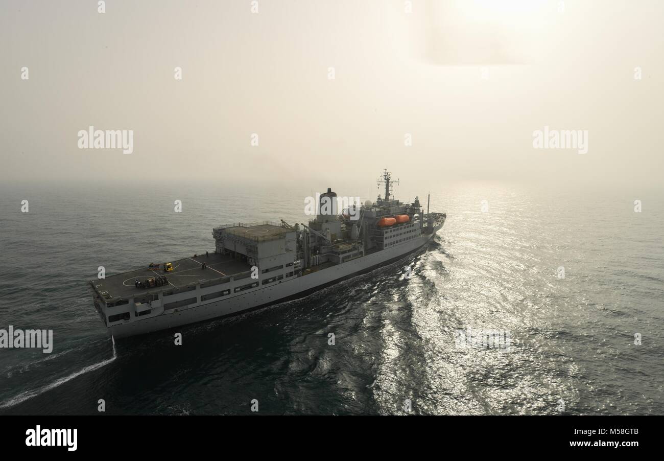180215-N-XC372-1681 ARABIAN GULF (Feb. 15, 2018) The United Kingdom’s Royal Fleet Auxiliary (RFA) Fort Rosalie (A385) transits the Arabian Gulf during a vertical replenishment-at-sea with the aircraft carrier USS Theodore Roosevelt (CVN 71). Theodore Roosevelt and its carrier strike group are deployed to the U.S. 5th Fleet area of operations in support of maritime security operations to reassure allies and partners and preserve the freedom of navigation and the free flow of commerce in the region. (U.S. Navy photo by Mass Communication Specialist 3rd Class Anthony J. Rivera/Released) Stock Photo