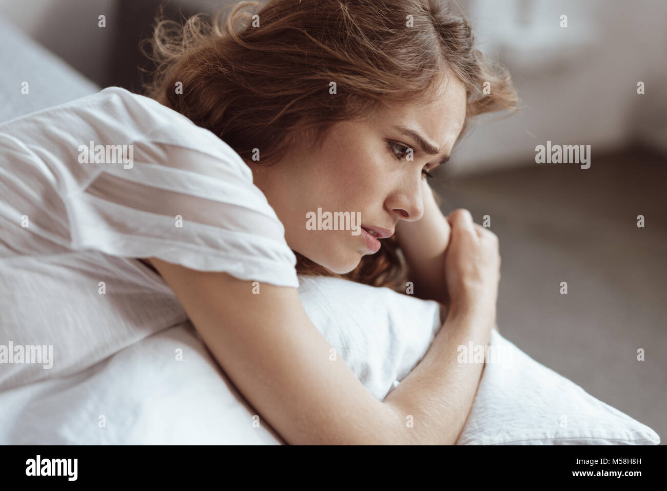 Confused lady thinking about her problem Stock Photo