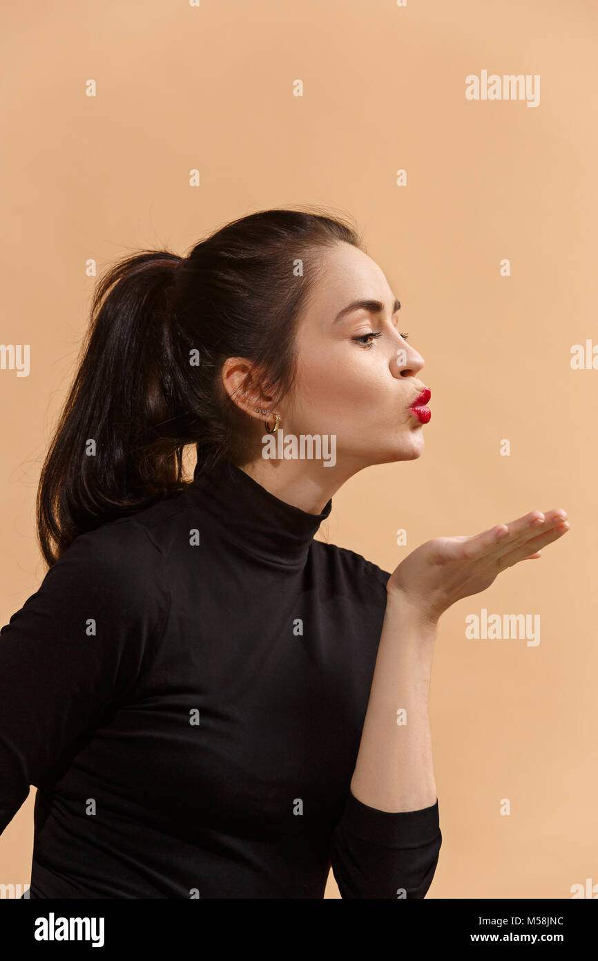 Woman blowing kiss profile hi-res stock photography and images - Alamy