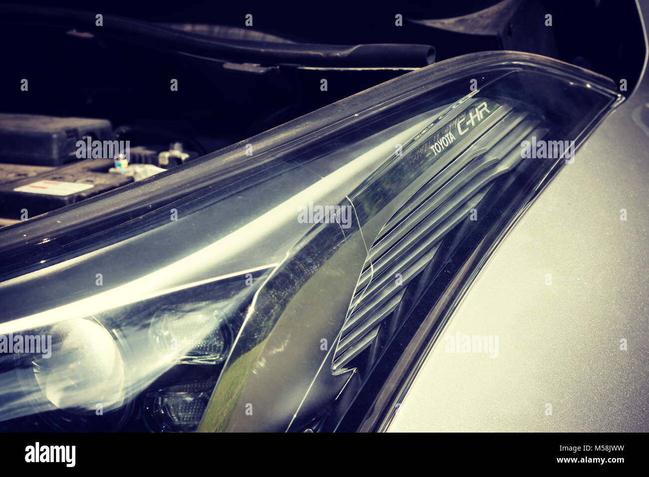 Concept shot of headlamp and part of modern crossover car - Toyota CH-R ...