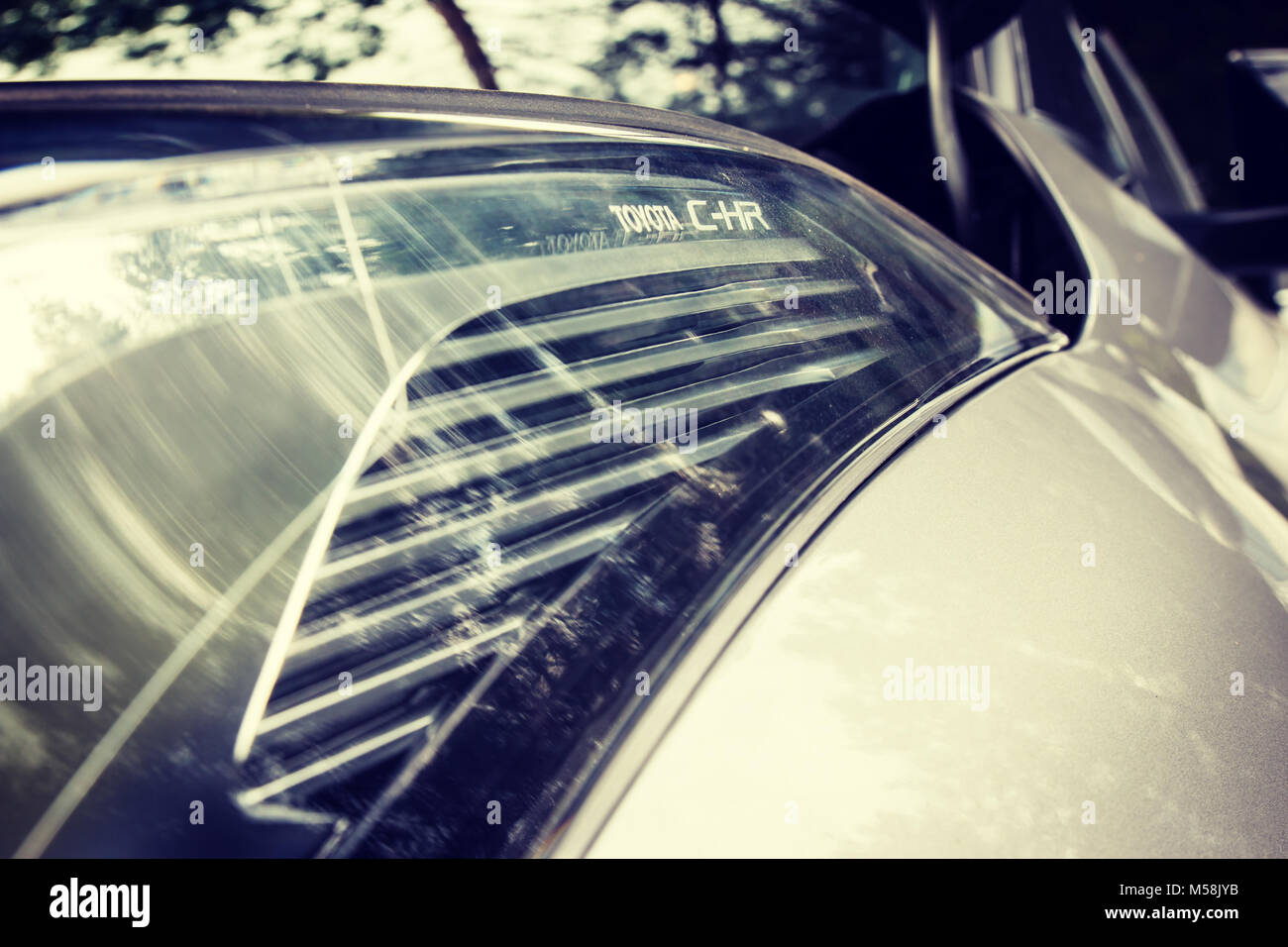 Concept shot of headlamp and part of modern crossover car - Toyota CH-R ...