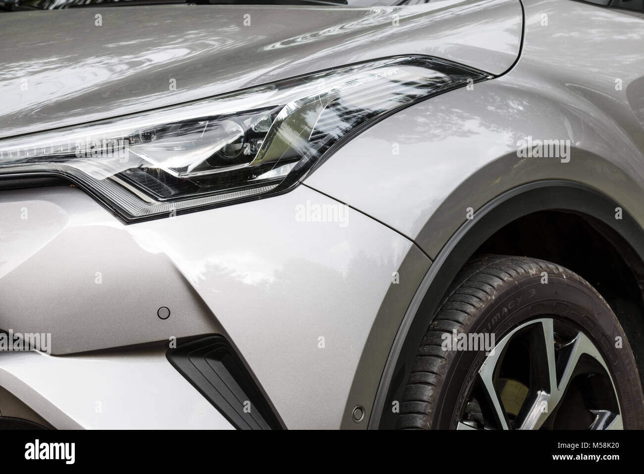 Concept shot of headlamp and part of modern crossover car - Toyota CH-R ...