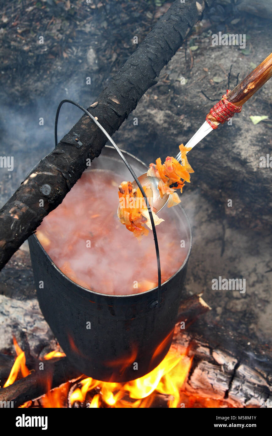 Cooking food in field conditions Stock Photo Alamy