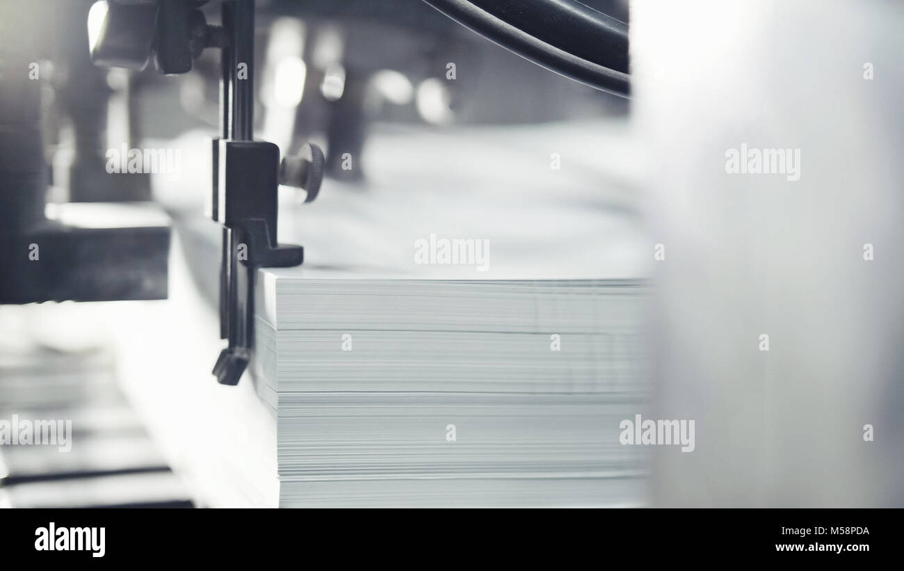 Printed sheets of paper are served in the printing press. Offset , CMYK ...