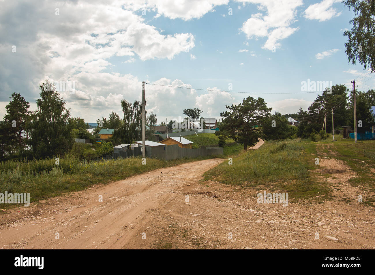 Russian rural landscape - dusty village road Stock Photo - Alamy