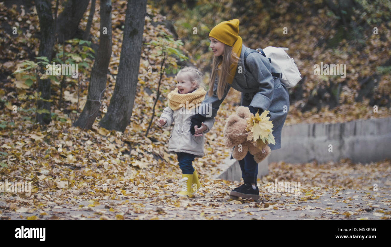 Mother and her daughter among autumn park Stock Photo - Alamy