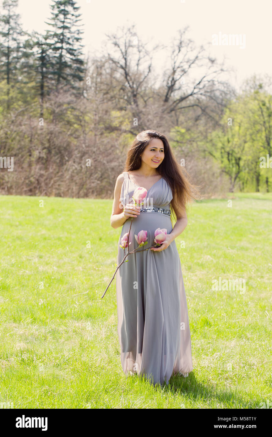 woman is walking in a meadow Stock Photo - Alamy