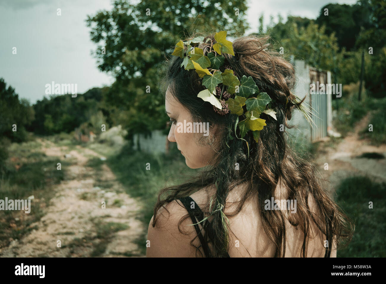 forest elf with plants in her hair, natural make-up Stock Photo