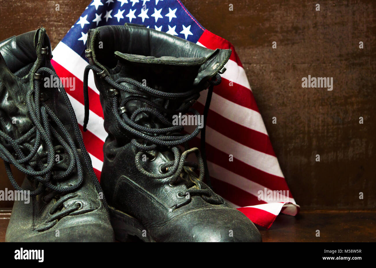 Old military army boots and USA flag Stock Photo