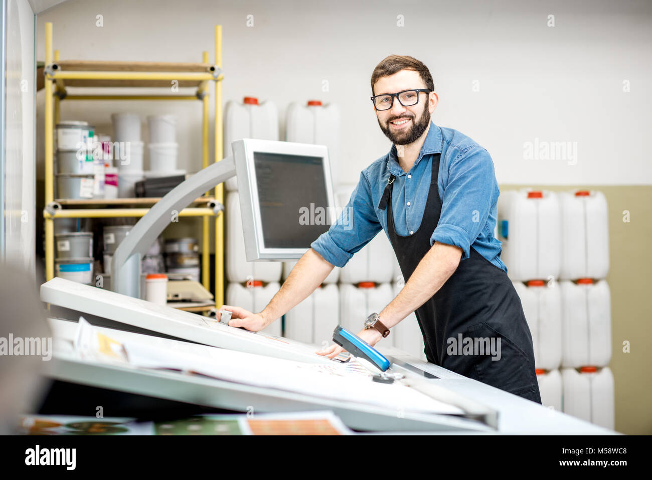 Portrait of a male worker at the printing manufacturing Stock Photo