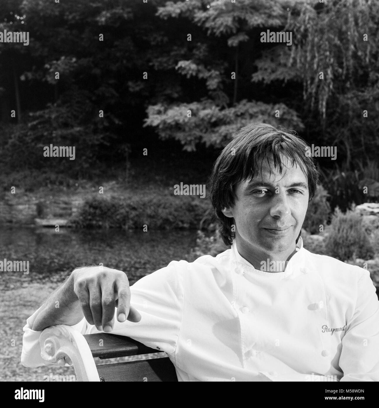 Celebrity chef Raymond Blanc photographed in the garden of his restaurant, Manoir de Quatre Saisons, Oxfordshire, England UK,  August 1990. Stock Photo