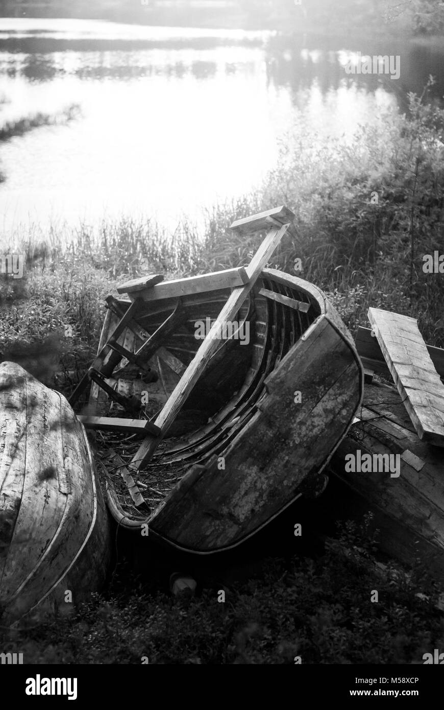 Sunset view wooden boat Black and White Stock Photos & Images - Alamy
