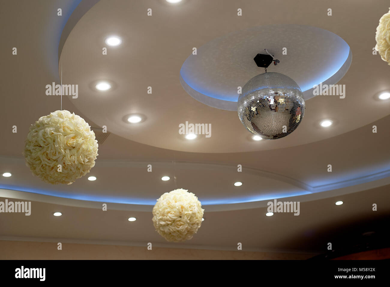 The High White Ceiling With Exposed Beams Decorated With