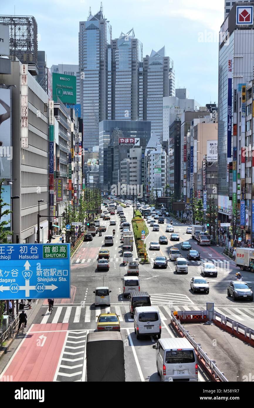 TOKYO, JAPAN - MAY 11, 2012: People drive in Shinjuku district, Tokyo ...