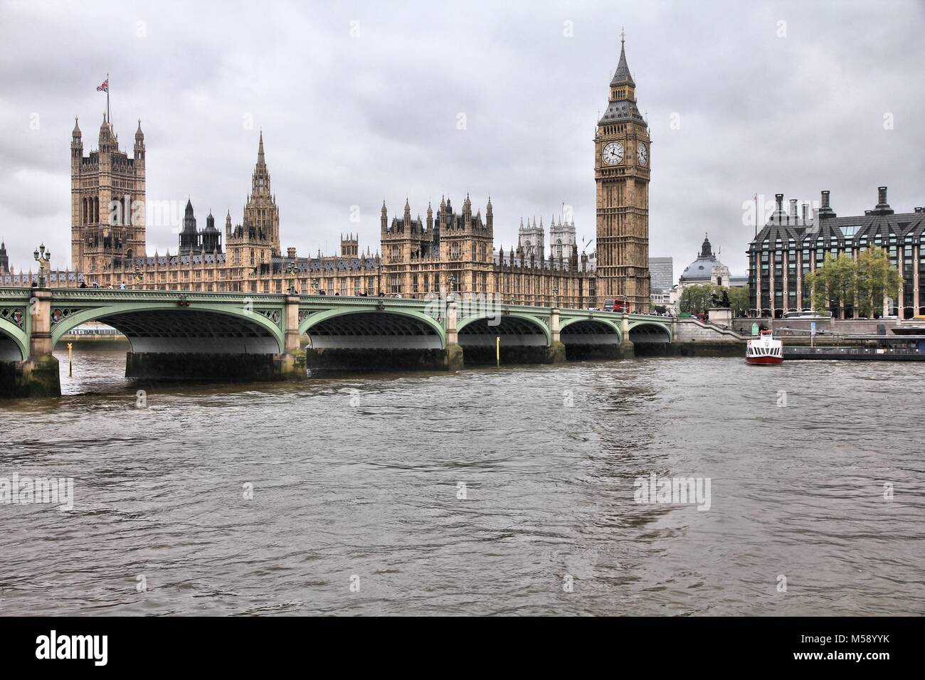 London, United Kingdom - rainy day view of Palace of Westminster (Houses of Parliament) with Big Ben clock tower and Victoria Tower. UNESCO World Heri Stock Photo