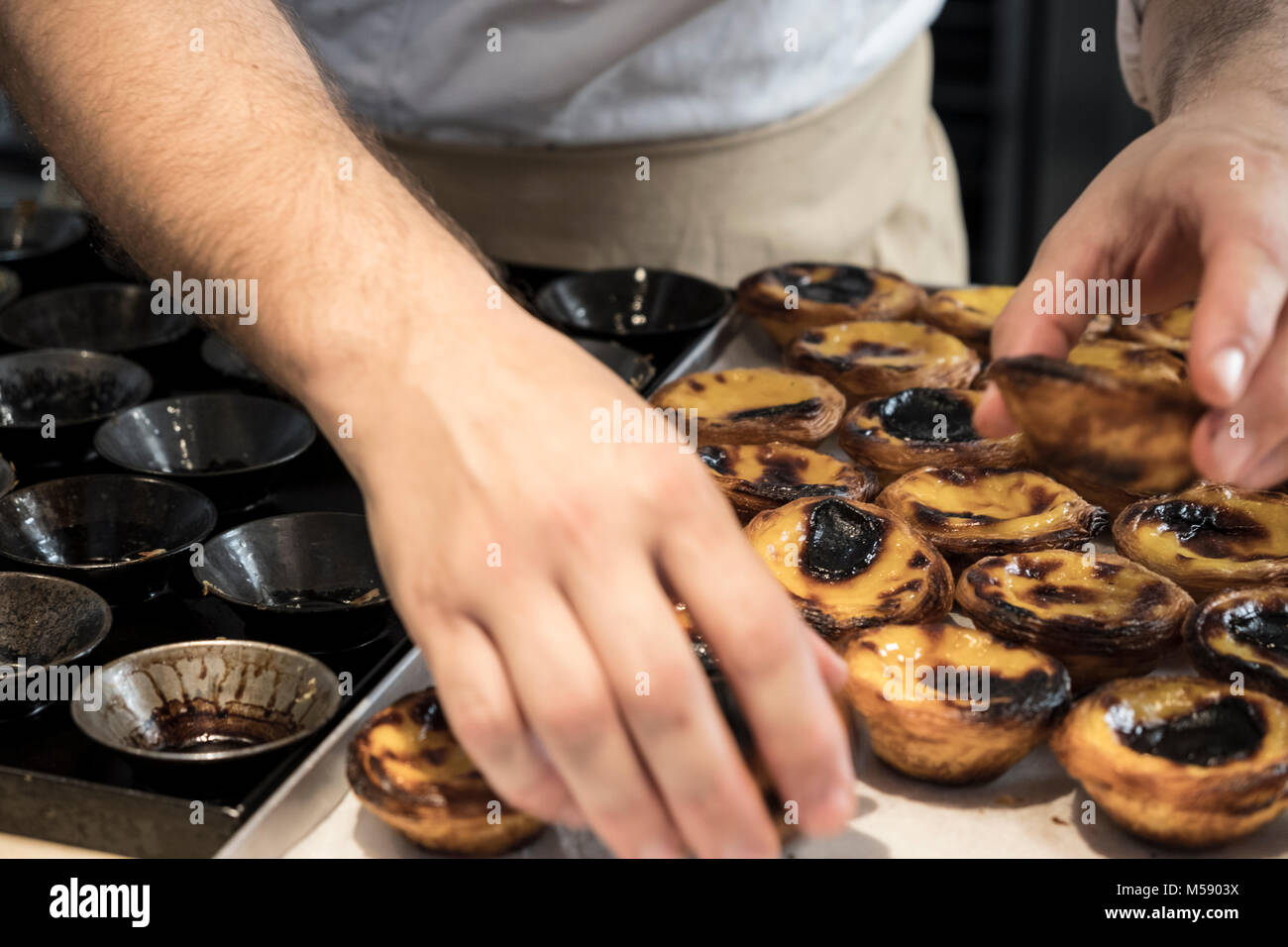 Famous Pastel de Nata pastry in kitchen,  Lisbon, Portugal Stock Photo