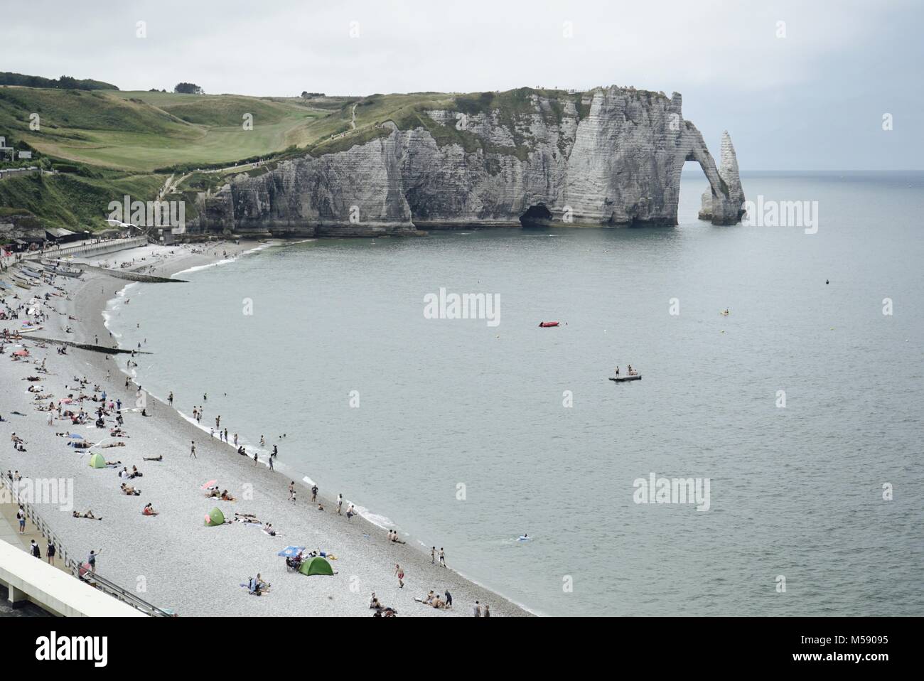 Etretat beach, with its famous chalk cliff, arch and needle in the ...