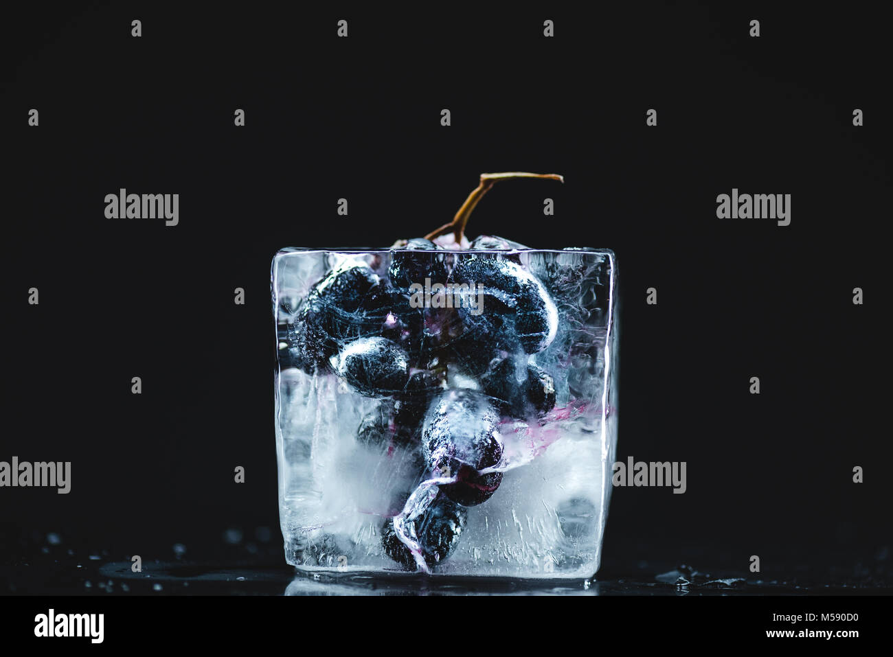 frozen grape in ice cube Stock Photo Alamy