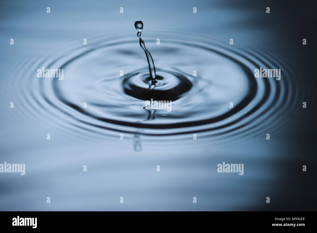 Splash on water surface Stock Photo - Alamy