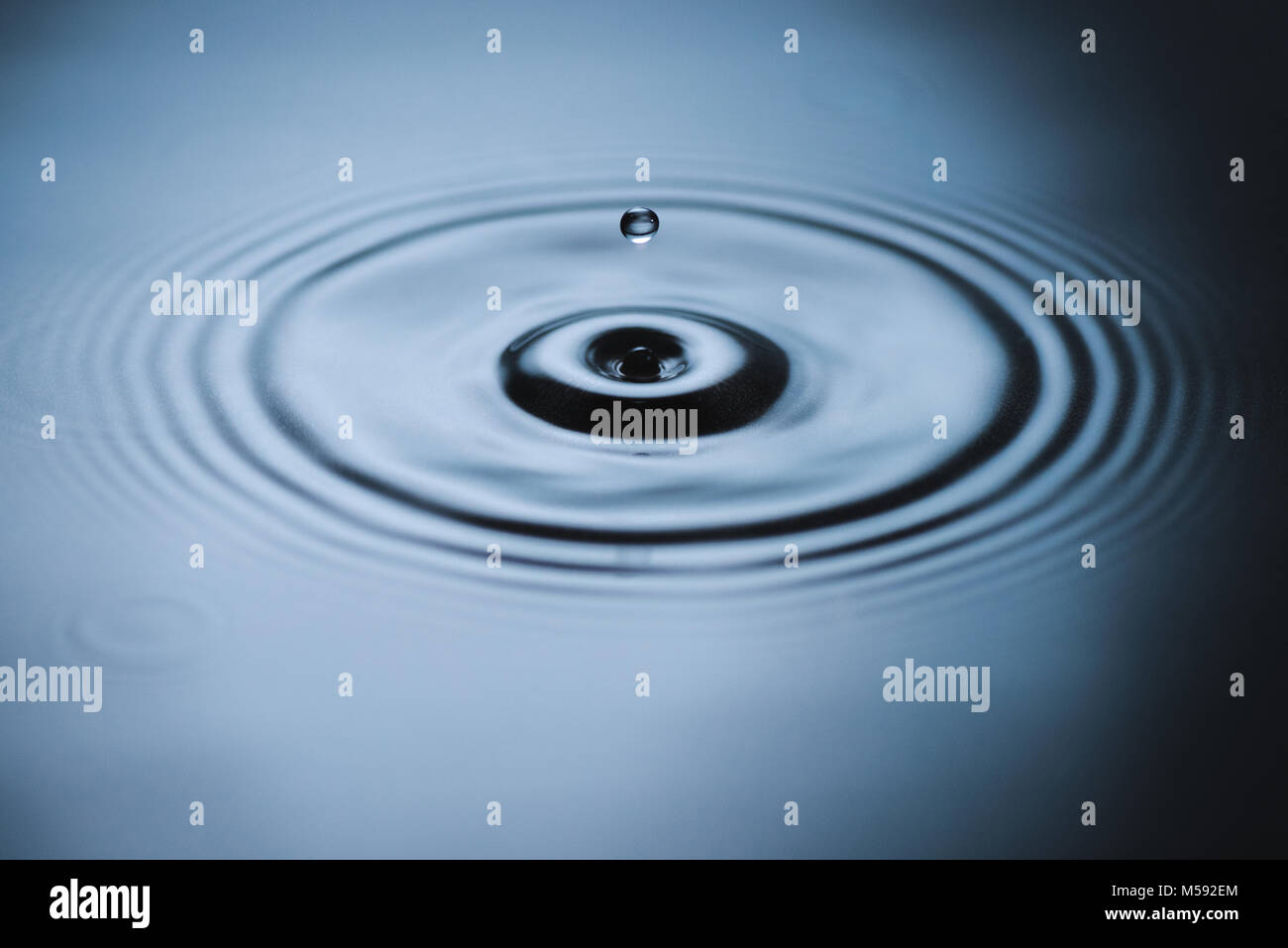 Splash on water surface Stock Photo - Alamy