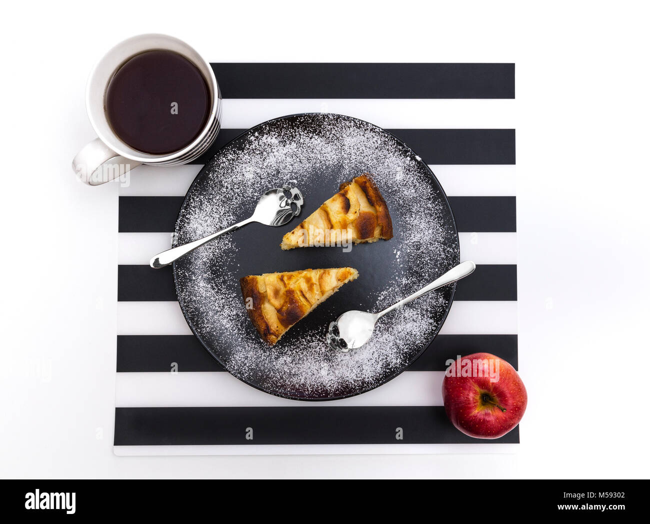 An Apple Pie shot from above, the spoons are shaped like a skull. Stock Photo