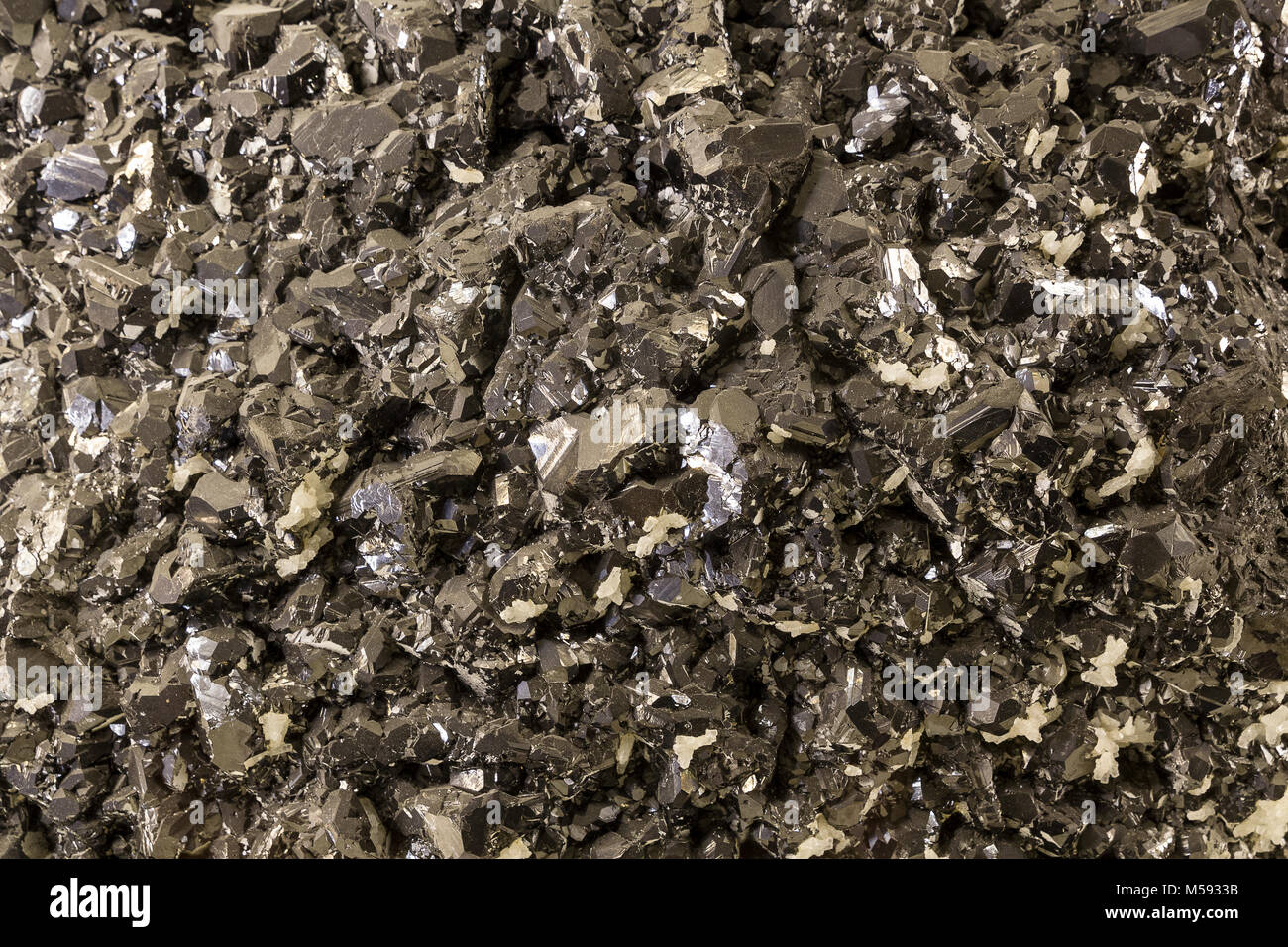 Silver rock creates a graphic background. Stock Photo