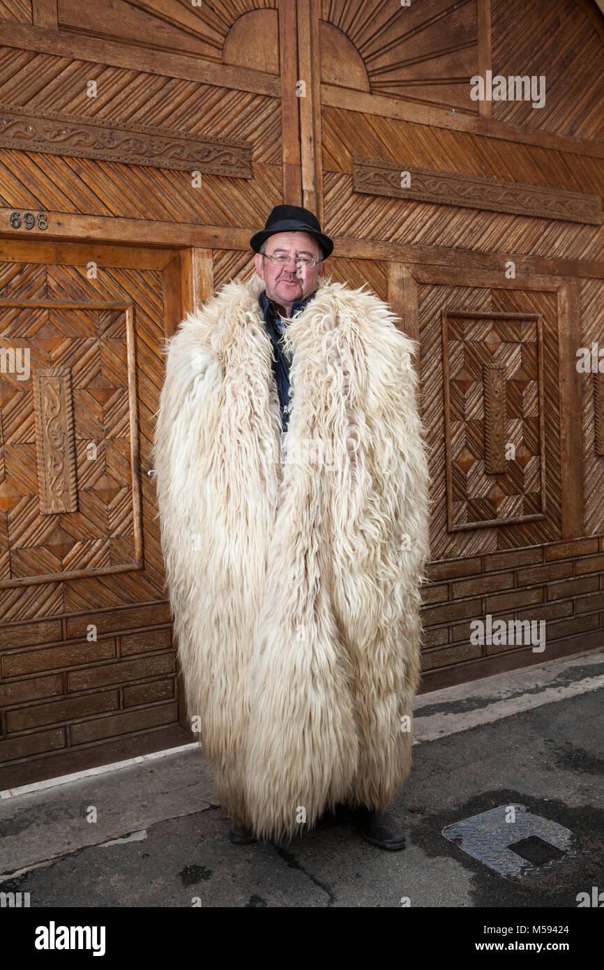 Romanian shepherd wearing a traditional coat made from sheep skins Stock  Photo - Alamy