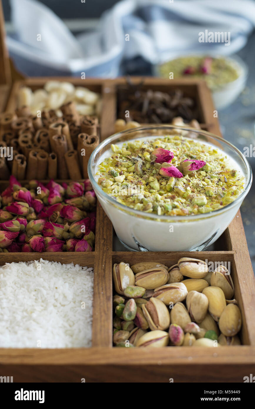 Arabic rice pudding on a box filled with spices Stock Photo